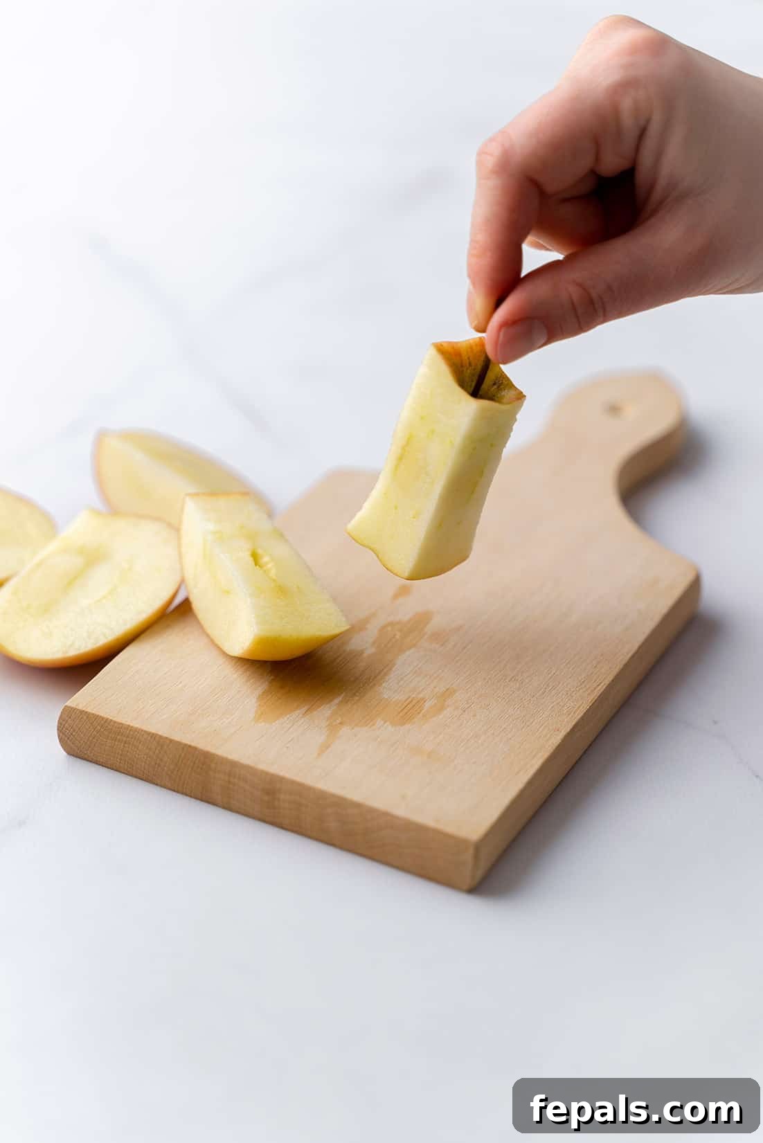 Properly Cored Apple one core of apple, clearly demonstrating the successful removal of all edible flesh