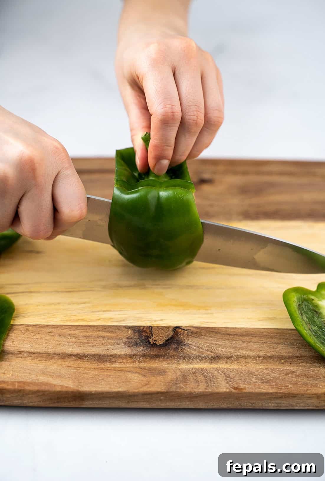 Master Bell Pepper Cutting Three Ways 6 Continue slicing around the green bell pepper to remove all four side panels, leaving the central core.