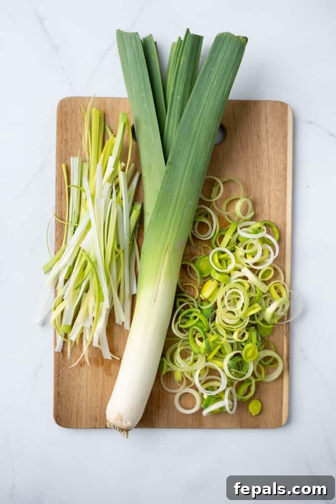 Mastering Leek Slicing 14 Leek on a cutting board with different cuts beside it.