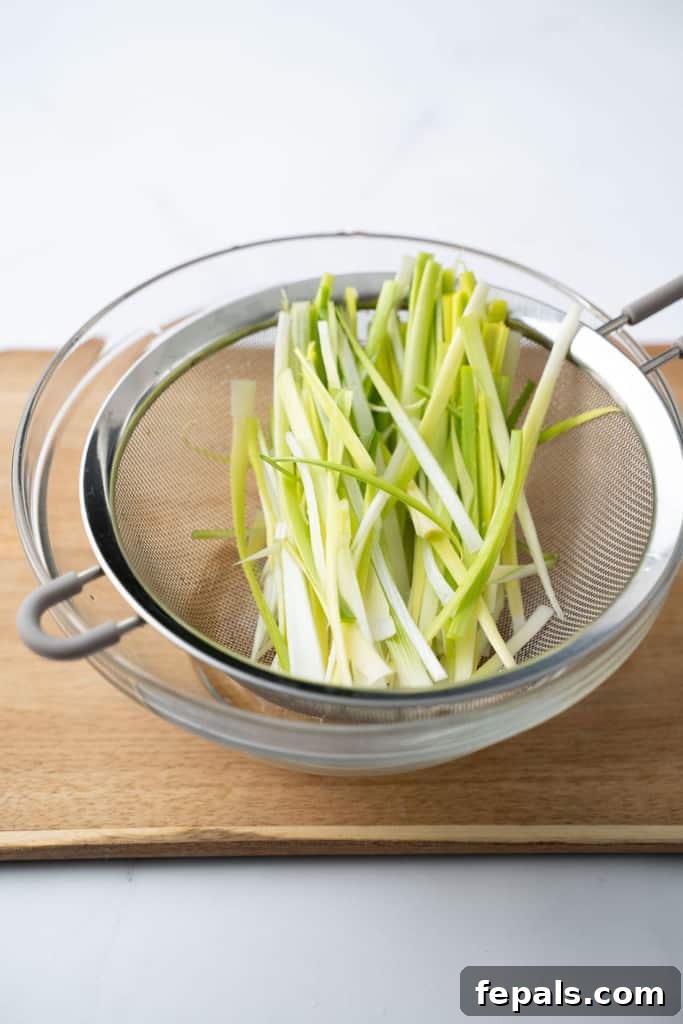 Mastering Leek Slicing 13 Sliced leeks in a fine mesh sieve.