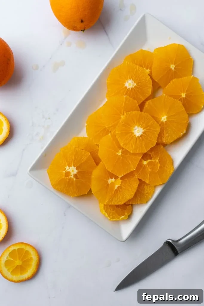 A platter of multiple slices of oranges, beautifully arranged.