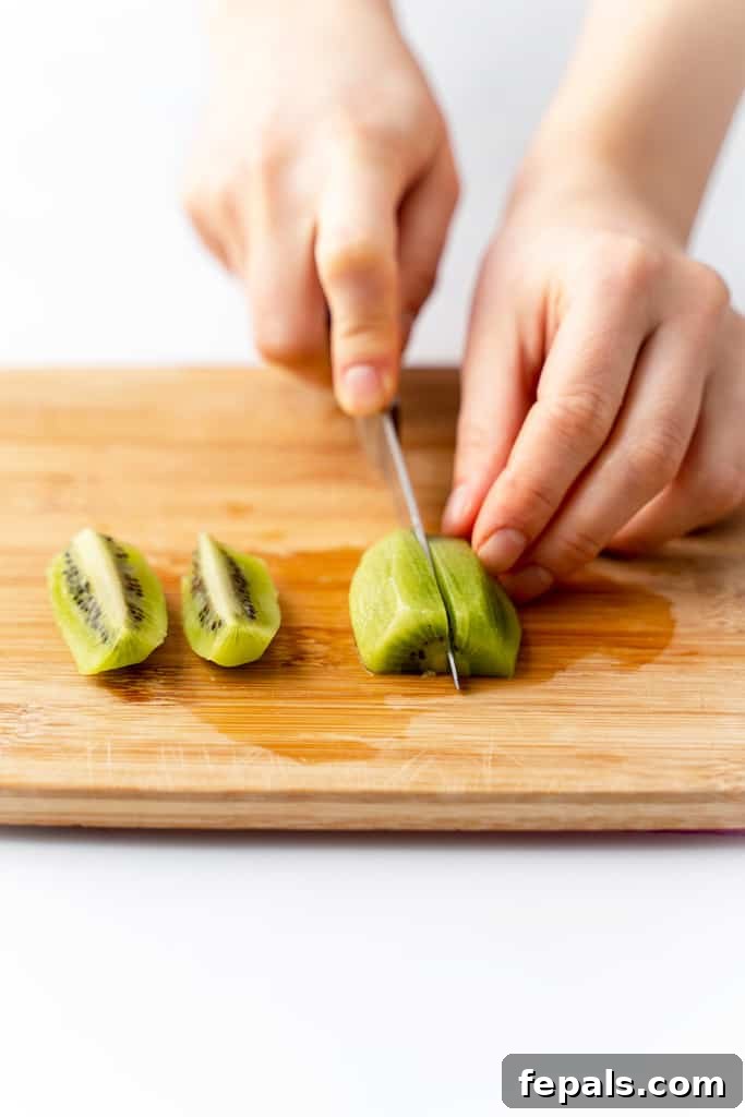 Effortless Kiwi Cutting Techniques 11 Cutting a kiwi into wedges.
