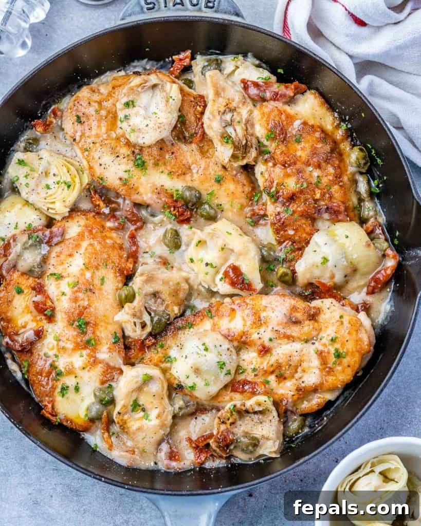 Zesty Mediterranean Skillet Chicken 2 top view Mediterranean Chicken in a black skillet