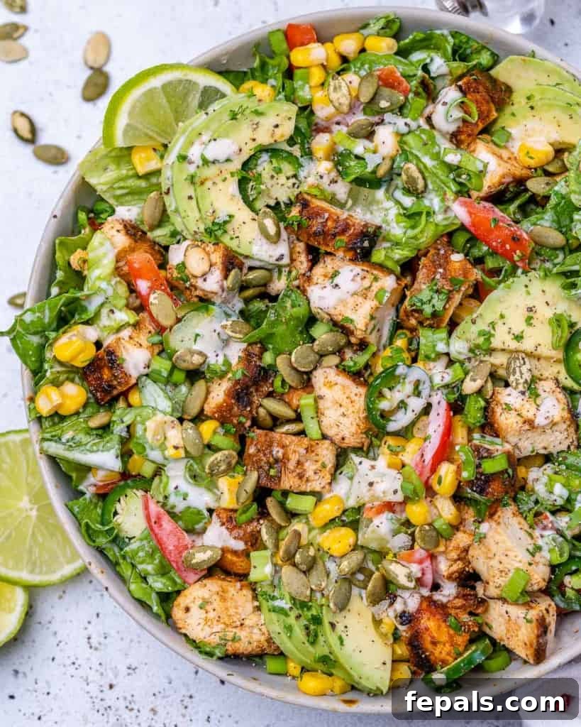 Ultimate Chopped Chicken Salad 2 Top view of a colorful chicken chopped salad with various vegetables and grilled chicken pieces