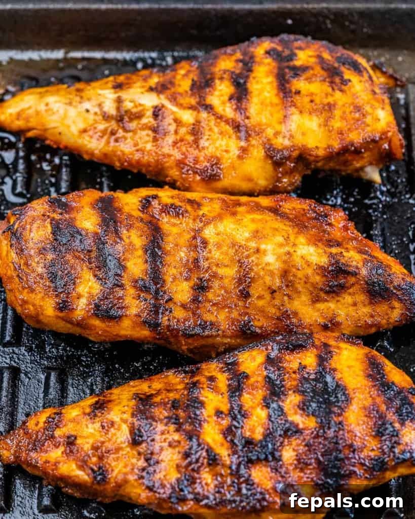 Ultimate Chopped Chicken Salad 6 Grilled chicken breast cooking on a grill pan with visible grill marks