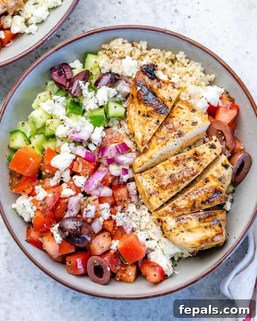 Mediterranean Grilled Chicken Power Bowl 2 top view grilled chicken with greek inspired salad and quinoa in a bowl