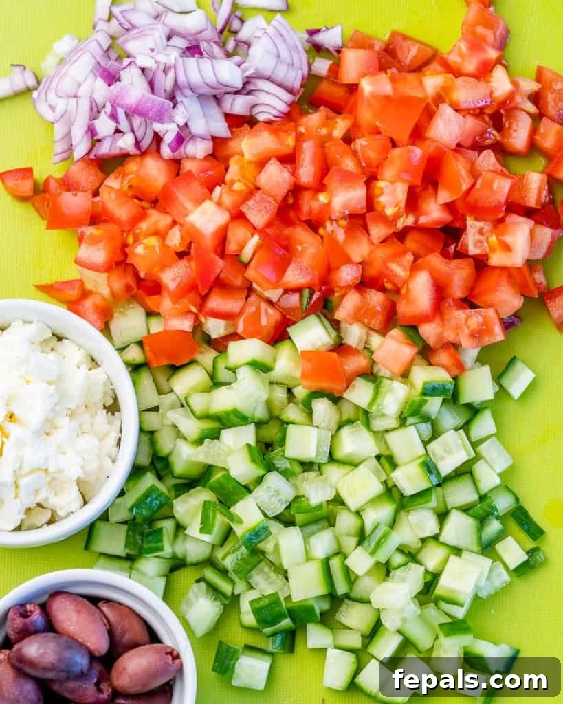 Mediterranean Grilled Chicken Power Bowl 6 Top view of diced veggies on cutting board