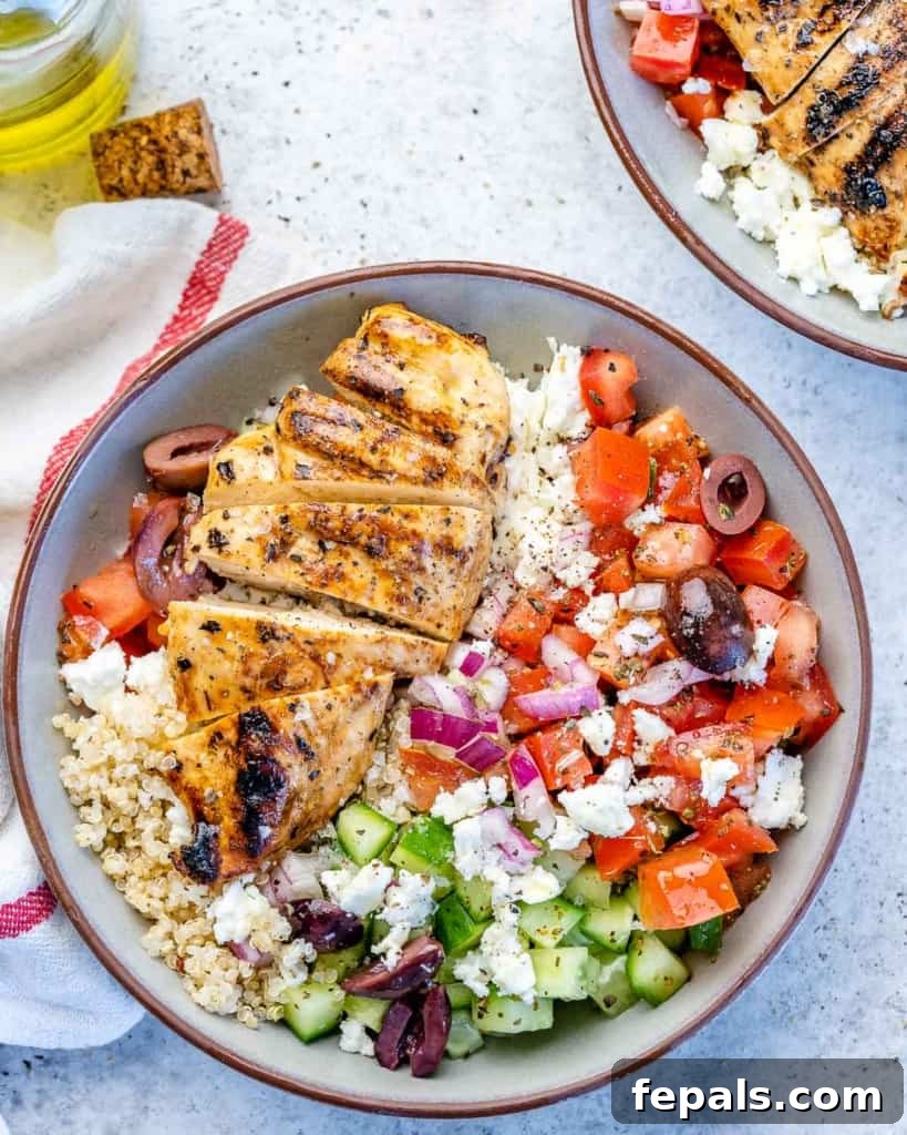 Mediterranean Grilled Chicken Power Bowl 7 One bowl filled with Greek chicken and vegetables