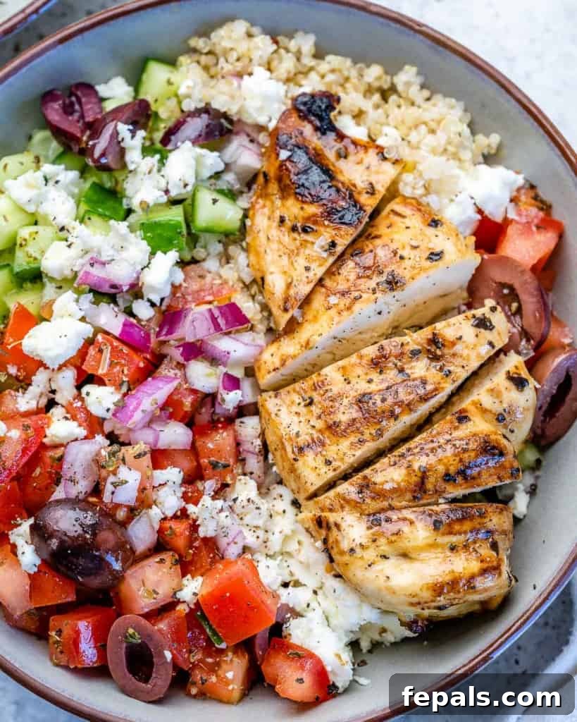 Mediterranean Grilled Chicken Power Bowl 8 Sliced chicken on top of Greek chicken bowl