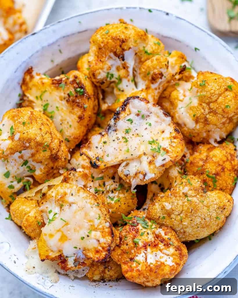 top view of roasted cauliflower in a white bowl