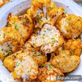 top view of roasted cauliflower in a white bowl