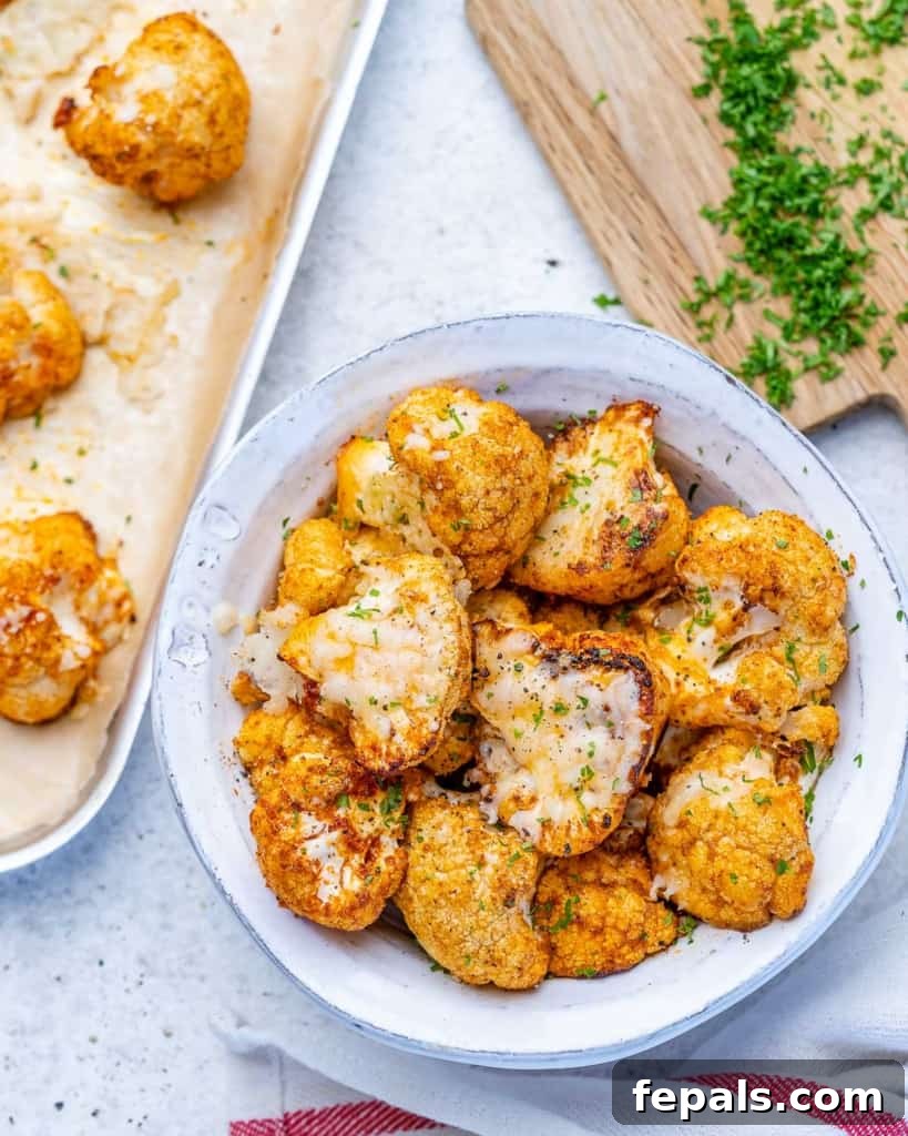 top view roasted cauliflower in a white bowl