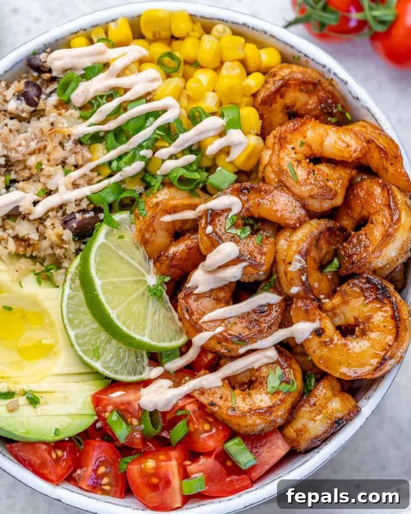close up top view of burrito bowl with shrimp and cawliflower rice 