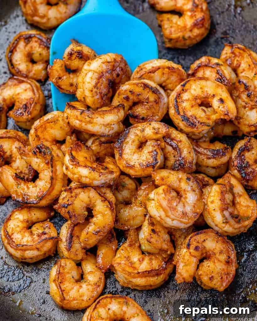 cooked shrimp in skillet for the shrimp burrito bowl