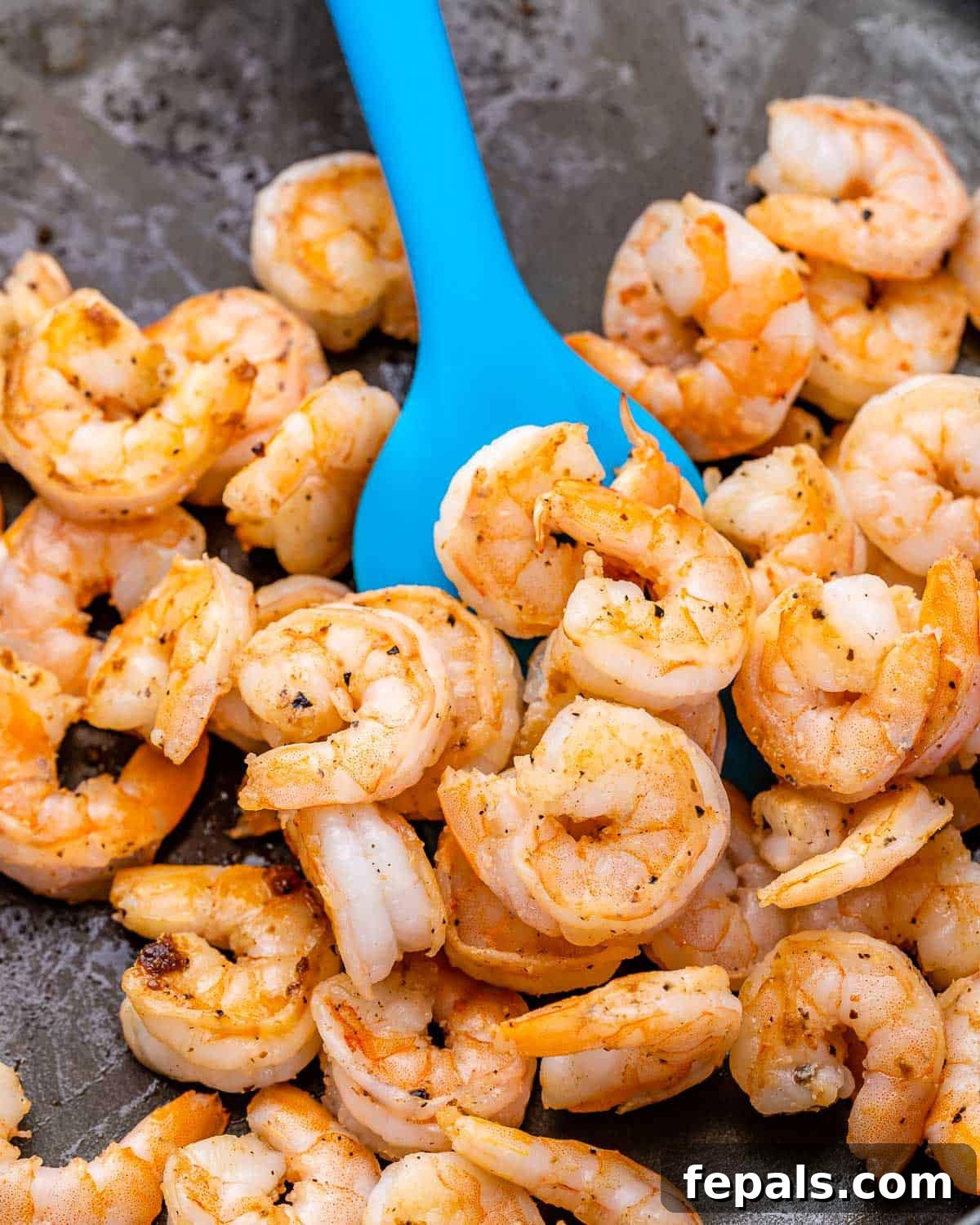 Refreshing Shrimp Salad 6 Cooked shrimp beautifully arranged on a skillet, waiting to be transferred to the salad bowl