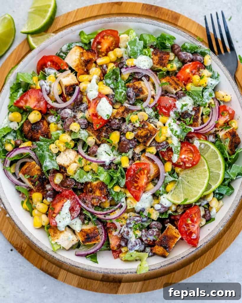 Fiesta Grilled Chicken Salad 4 Top view of chopped chicken salad generously mixed with dressing and served in a white bowl.