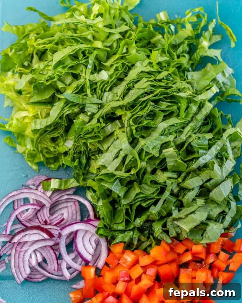 chopped lettuce, onions, and red peppers