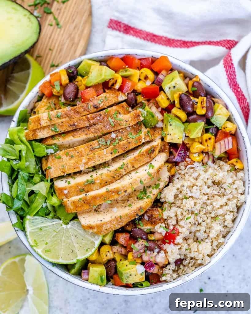 top view chicken quinoa taco bowl with sliced chicken breast and corn and bean salsa 
