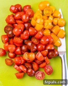 chopped tomatoes on a cutting board