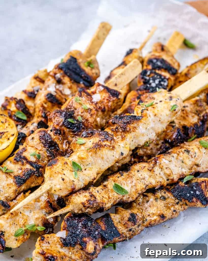top view of grilled lemon chicken kabobs garnished with parsley