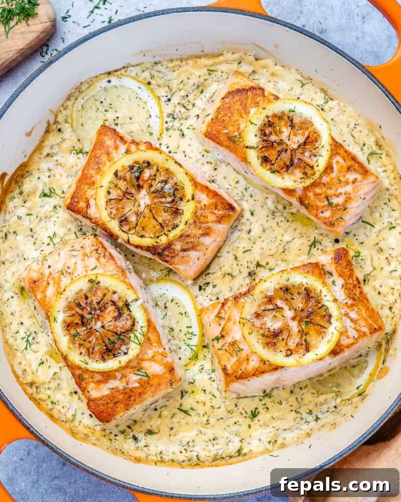 Silky Lemon Cream Salmon 8 top view salmon in a creamy sauce in an orange pan