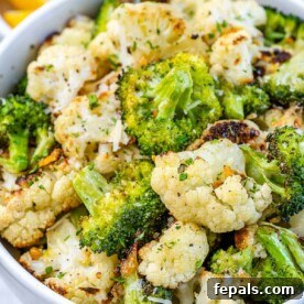 view of broccoli and cauliflower in white bowl with parsley