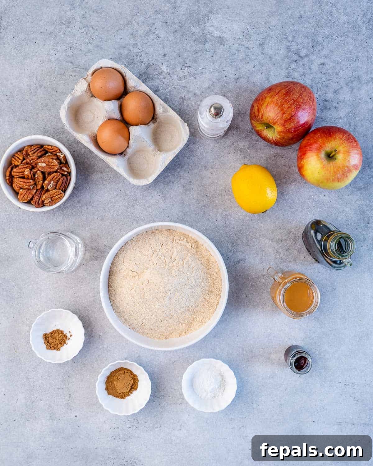eggs, pecans, flour, apples, lemon, maple syrup, baking powder, cinnamon, all spice, 