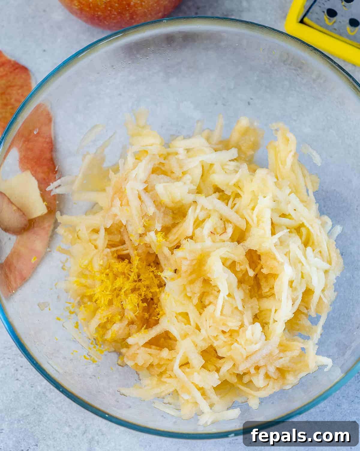 shredded apples in bowl