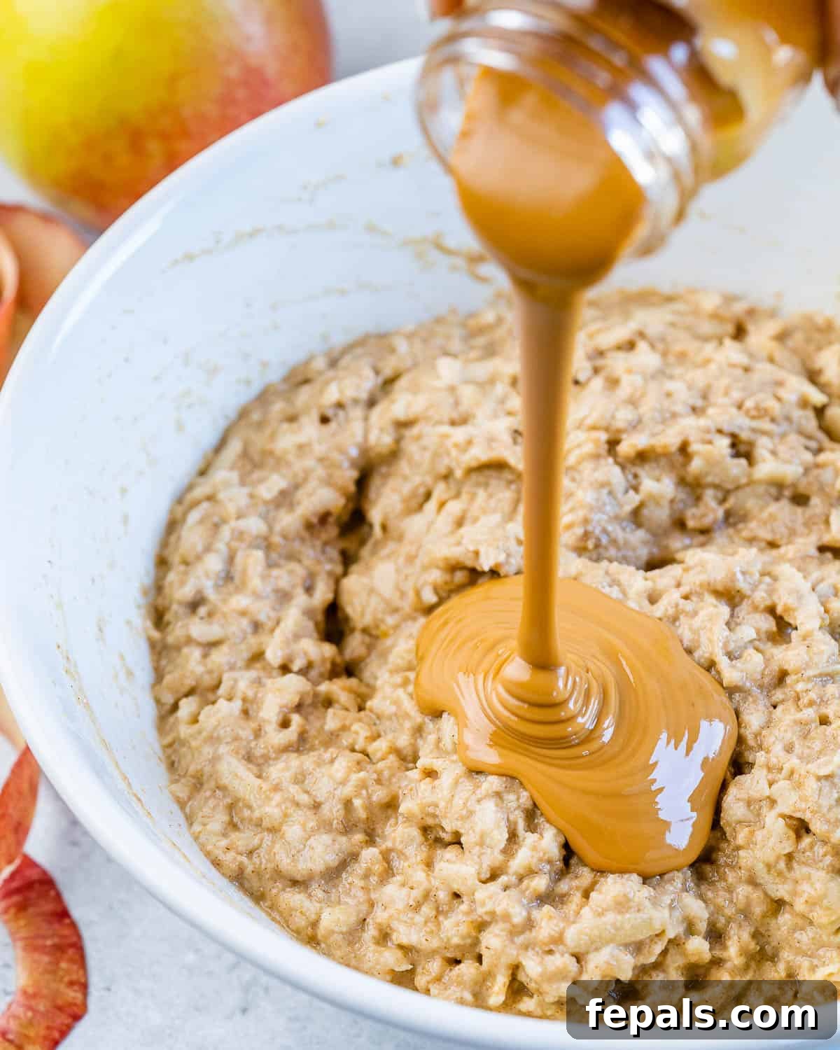 peanut butter being poured over batter