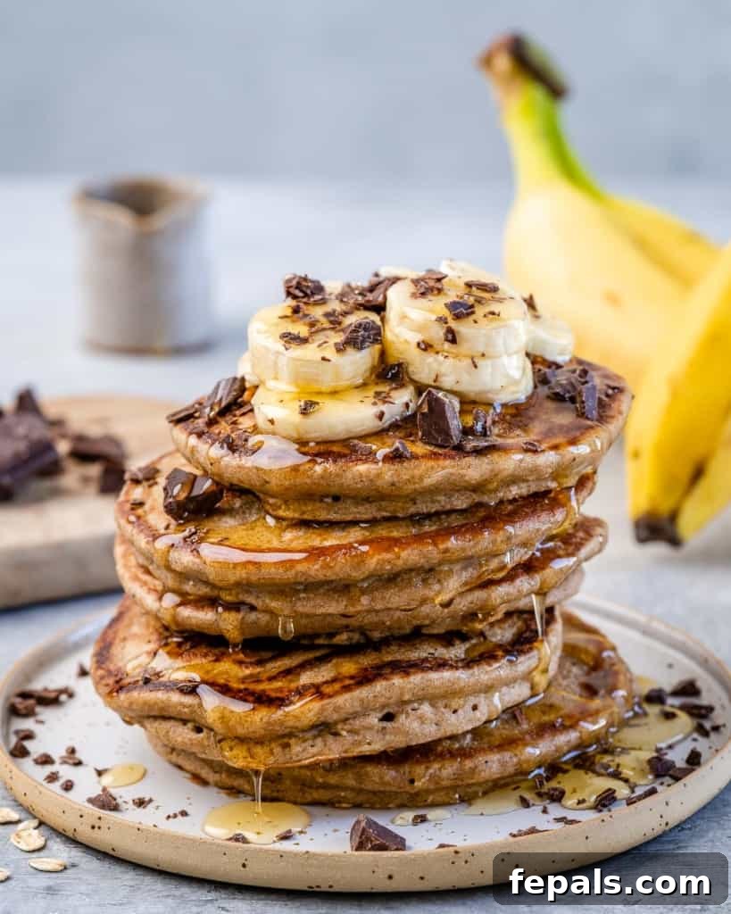 Wholesome Banana Oat Flapjacks 3 front stack of banana pancakes on plate