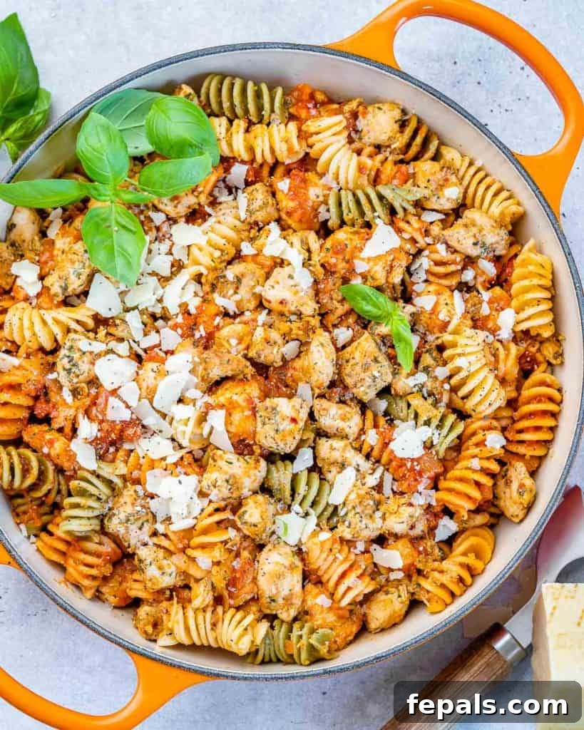 Comforting Chicken Parmesan Pasta 2 top view of chicken pasta in an orange skillet