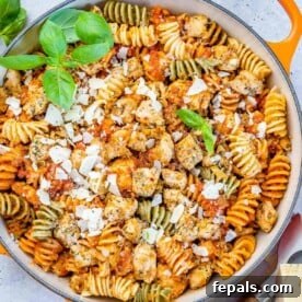 Comforting Chicken Parmesan Pasta 10 top view of chicken pasta in an orange skillet