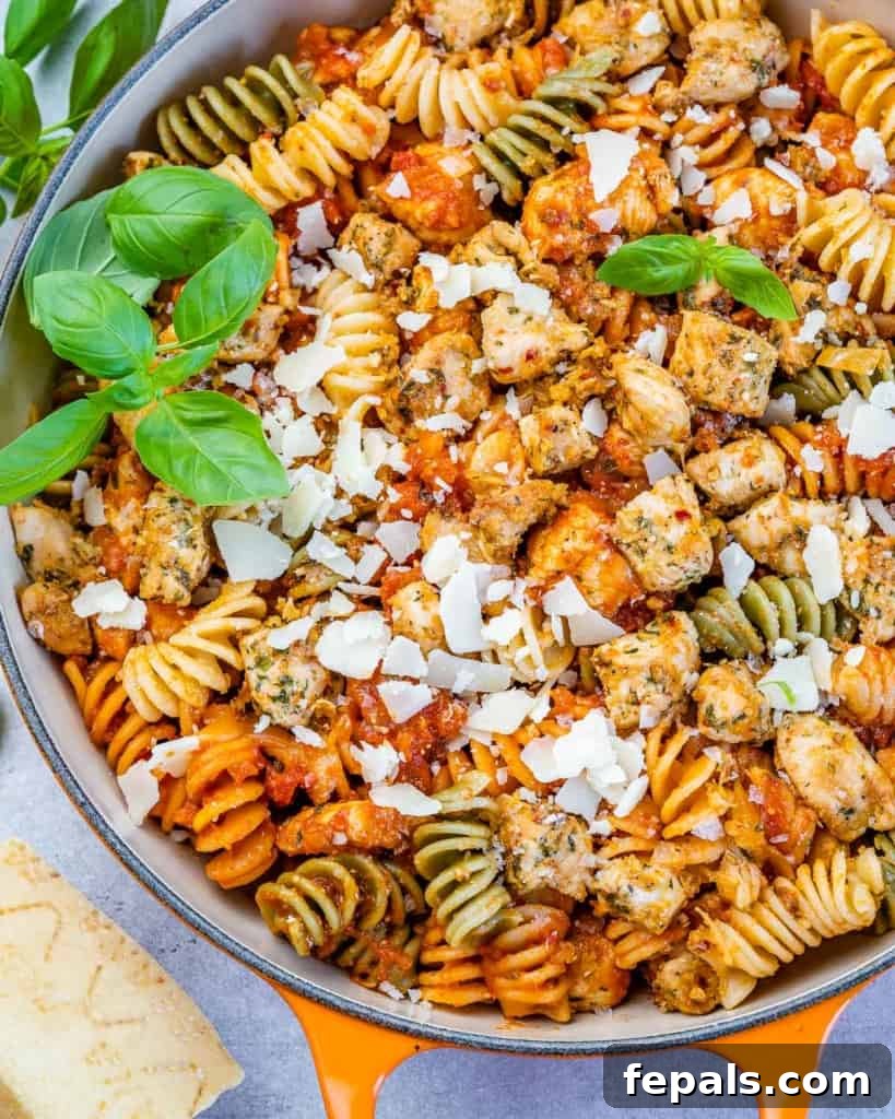 Comforting Chicken Parmesan Pasta 3 close up chicken parmesan pasta topped with shredded parmesan