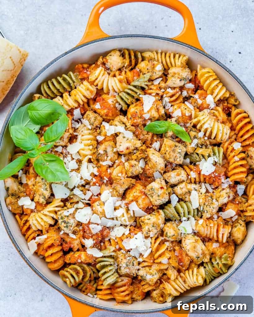 Comforting Chicken Parmesan Pasta 9 top view of chicken pasta in an orange skillet