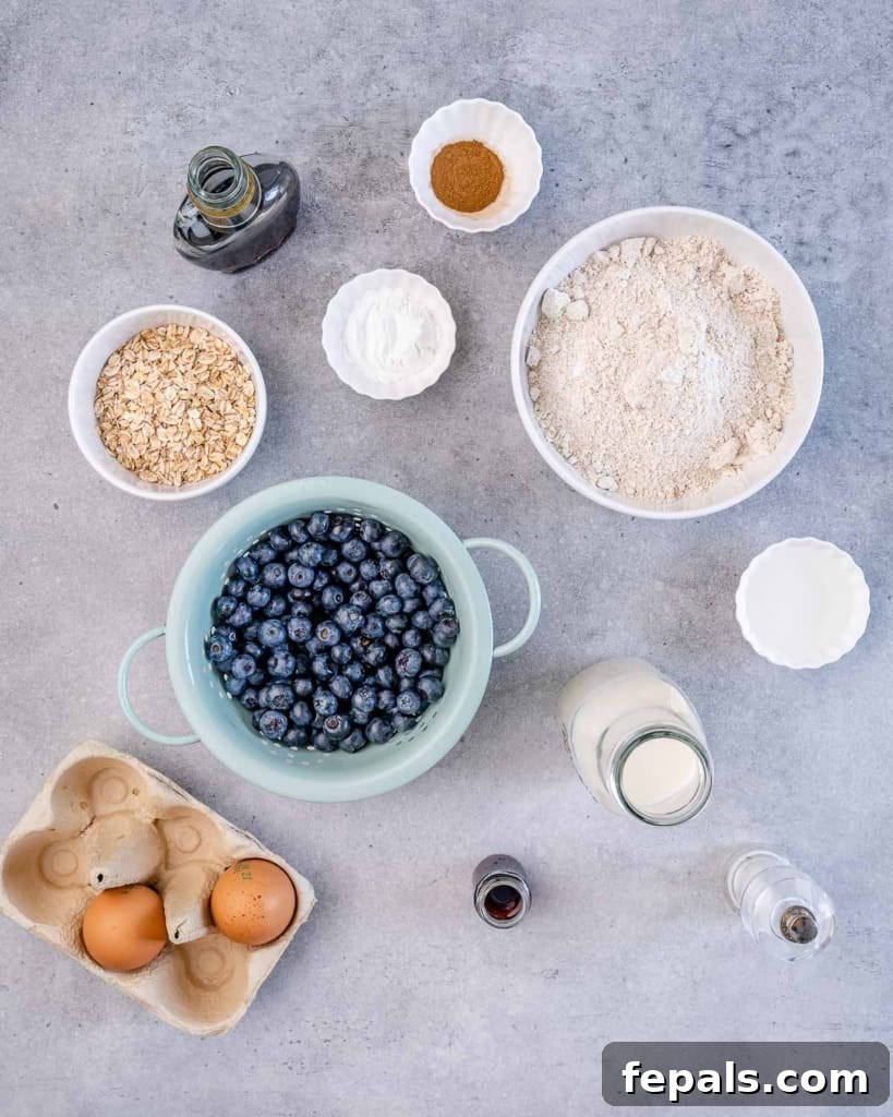 Assortment of fresh ingredients laid out, ready to make blueberry muffins.