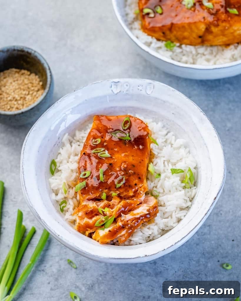 Sweet and Sticky Pan Seared Salmon 9 side shot of seared salmon over rice in a bowl