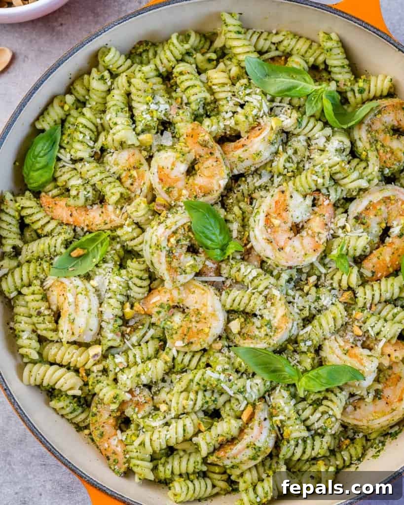 top view pesto shrimp pasta in skillet 