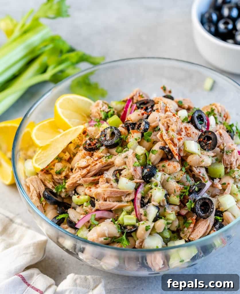 Wholesome White Bean Tuna Medley 3 side shot of tuna white bean salad in a clear bowl