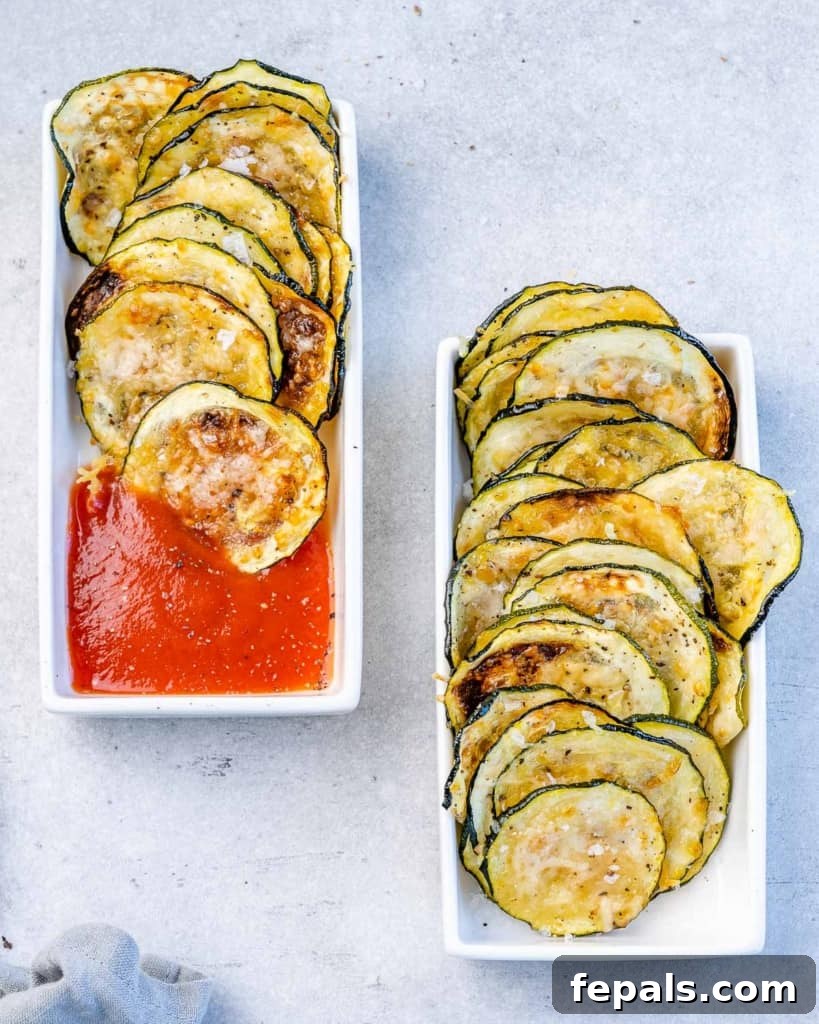 Crispy Air Fryer Zucchini Bites 2 two small bowls of zucchini chips, one of them with marinara sauce