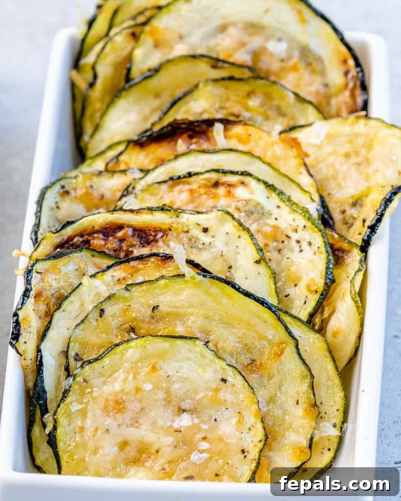 Crispy Air Fryer Zucchini Bites 7 close up crispy zucchini chips placed in a small dish
