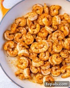 cooked cajun shrimp in a skillet