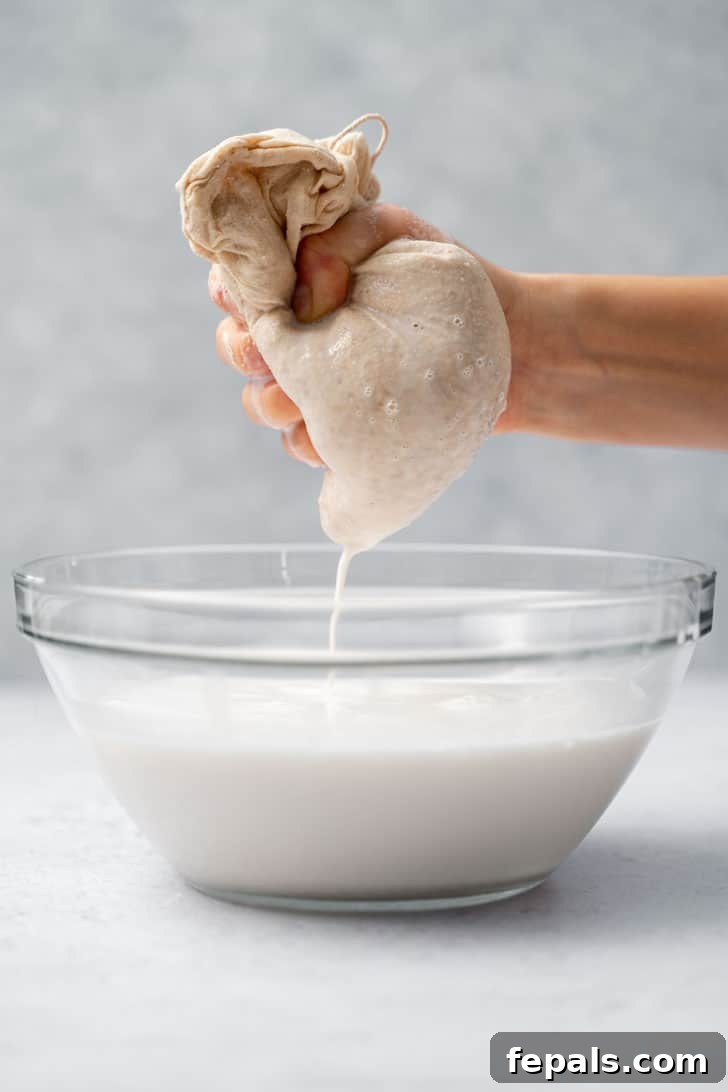 squeezing bag of almond milk 