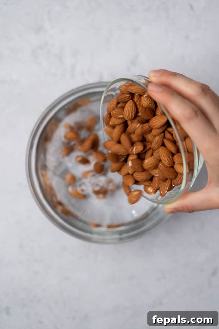 pouring almond milk in bowl with cold filtered water