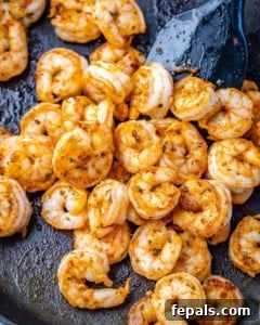sauteed shrimp in a black skillet for risotto