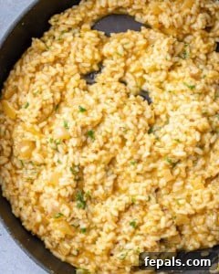 top view of creamy risotto in a black skillet