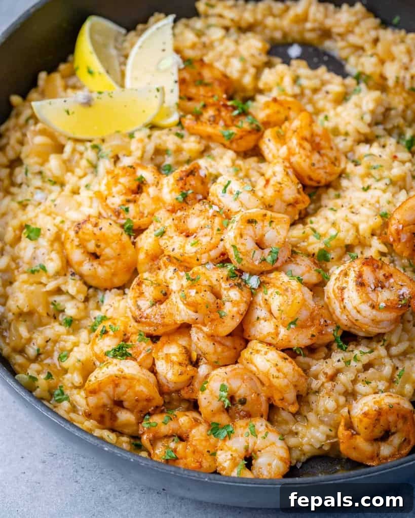 Golden Garlic Shrimp Risotto 9 side shot of risotto topped with sauteed shrimp and lemon garnishes