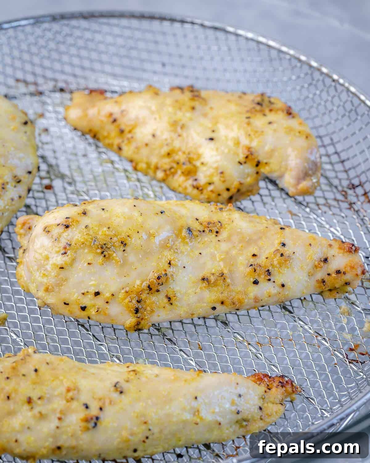 air fried chicken breast on the wire wrack of air fryer