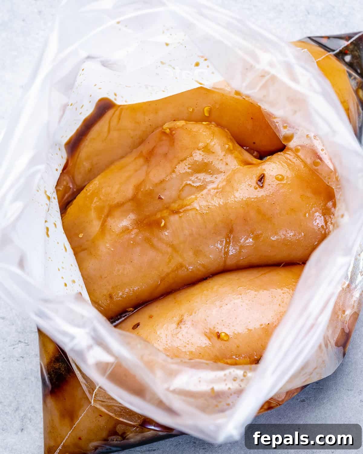 chicken breasts in bag with marinade