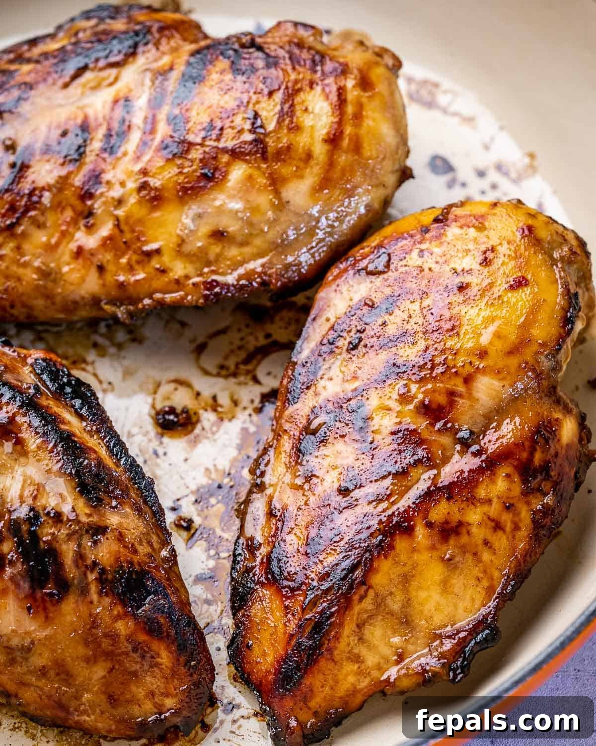 cooked chicken in pan.
