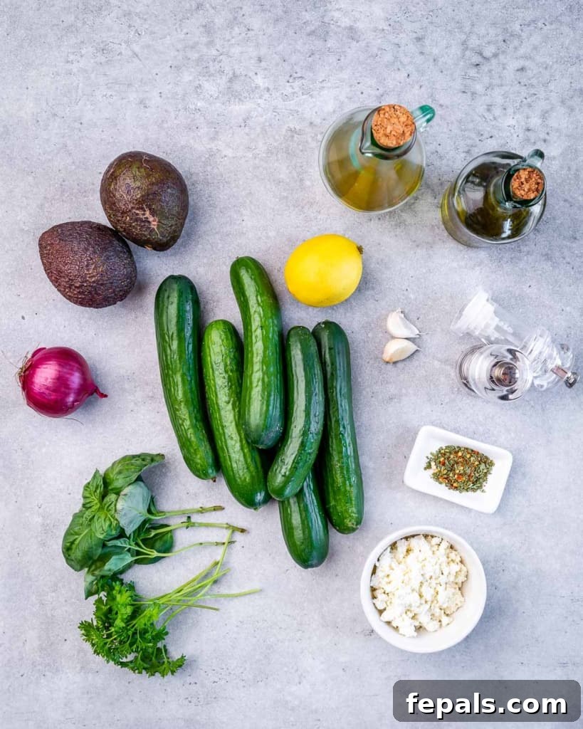 ingredients laid out to make the cucumber avocado feta salad